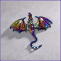 Preview: Brosche „Flugdrache“ in schillernden Regenbogenfarben