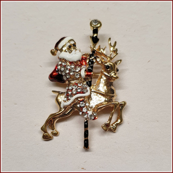 Brosche "Santa & sein Karussell-Rentier"