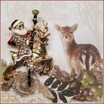 Brosche "Santa & sein Karussell-Rentier"