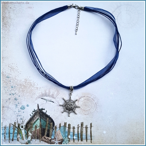 "Steuer" am marineblauen Halsband