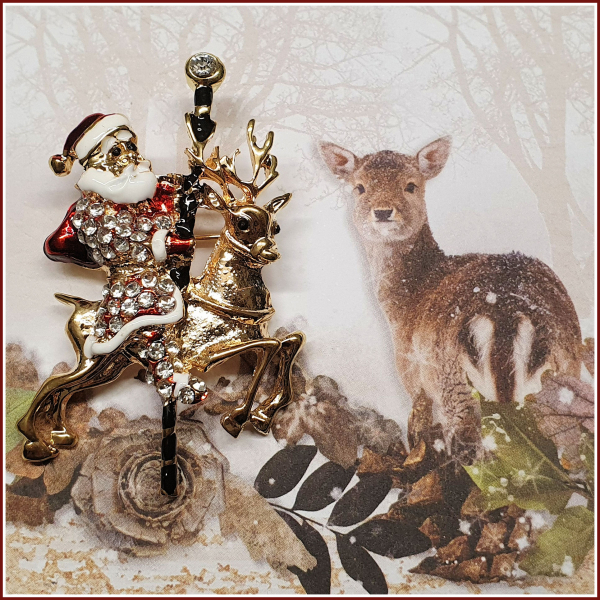 Brosche "Santa & sein Karussell-Rentier"
