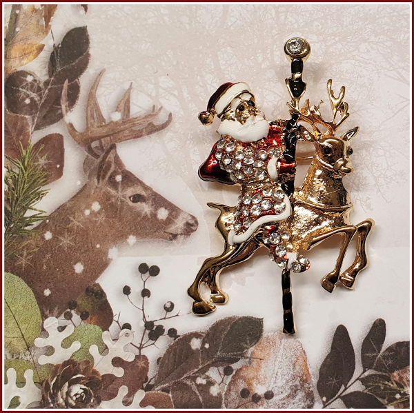 Brosche "Santa & sein Karussell-Rentier"